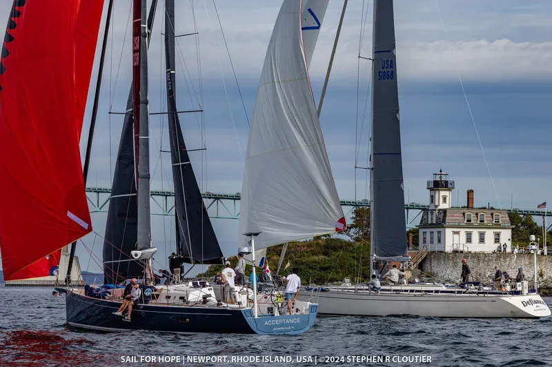 Slide: The Image of Sailboats, including a 2024 J Boats J/45, racing near a lighthouse in Newport, Rhode Island. - 9