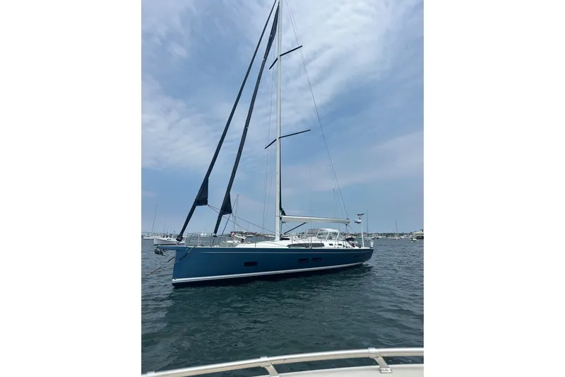 Slide: The Image of 2024 J Boats J/45 sailboat on calm water under a partly cloudy sky. - 5