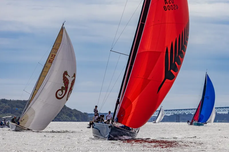 Slide: The Image of Sailboats racing in Newport, Rhode Island, featuring a 2024 J Boats J/45. - 7