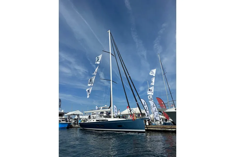 Slide: The Image of 2024 J Boats J/45 sailboat docked at marina under clear blue sky. - 18