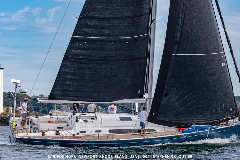 Slide: The Image of 2024 J Boats J/45 sailing in Newport, Rhode Island, with crew on deck. - 6