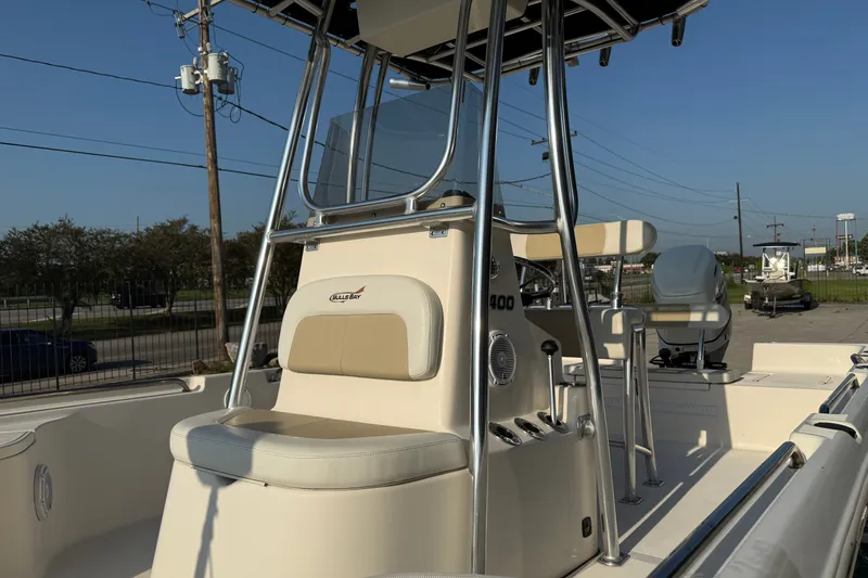 Slide: The Image of 2020 Bulls Bay 2400 XS boat with center console and seating, parked outdoors. - 14