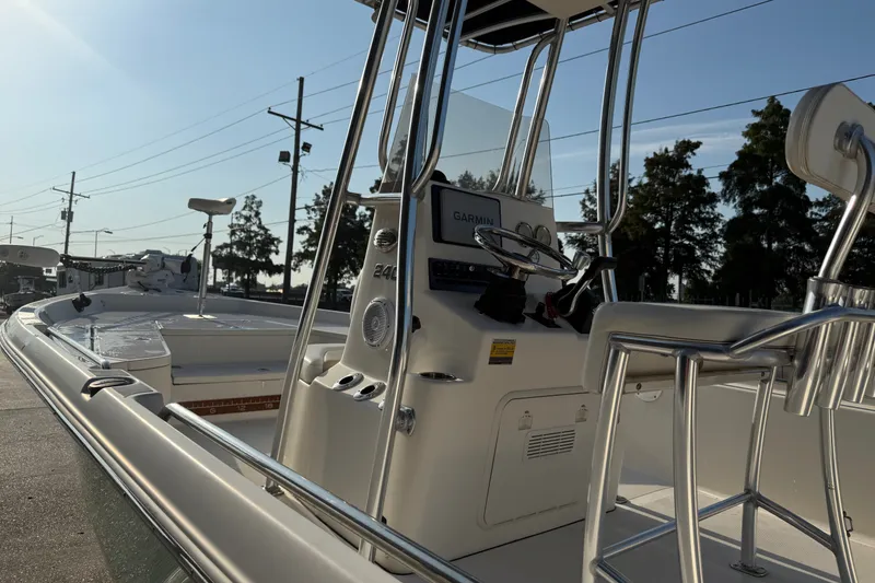 Slide: The Image of 2020 Bulls Bay 2400 XS boat with console and seating, parked outdoors. - 11