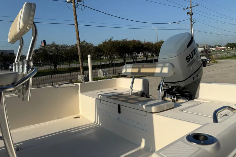 Slide: The Image of 2020 Bulls Bay 2400 XS boat with Suzuki outboard motor in a parking area. - 12