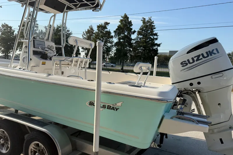Slide: The Image of 2020 Bulls Bay 2400 XS boat with Suzuki engine on trailer. - 9