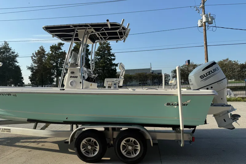 Slide: The Image of 2020 Bulls Bay 2400 XS boat on trailer with Suzuki outboard motor. - 8