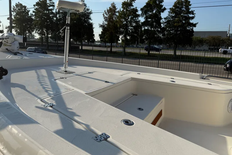Slide: The Image of 2020 Bulls Bay 2400 XS boat deck with seating and storage compartments. - 13