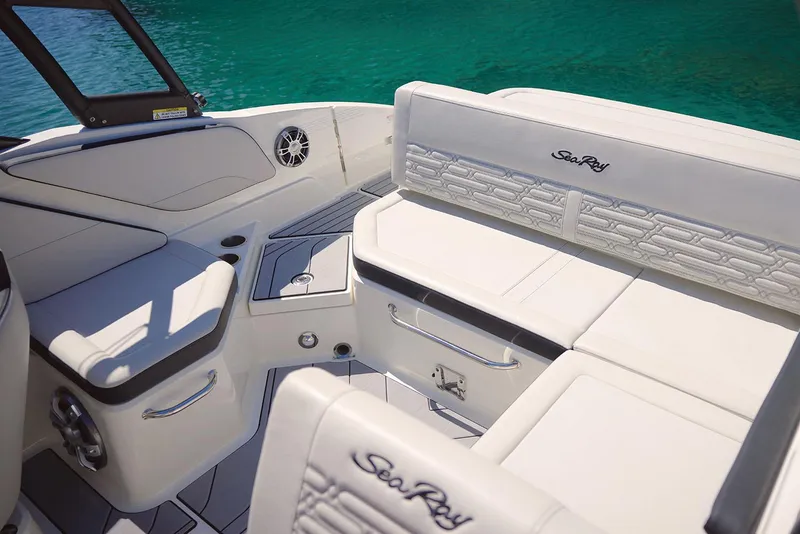 Slide: The Image of Manufacturer Provided Image: 2025 Sea Ray SPX 210 boat interior with white seating and sleek design. - 8