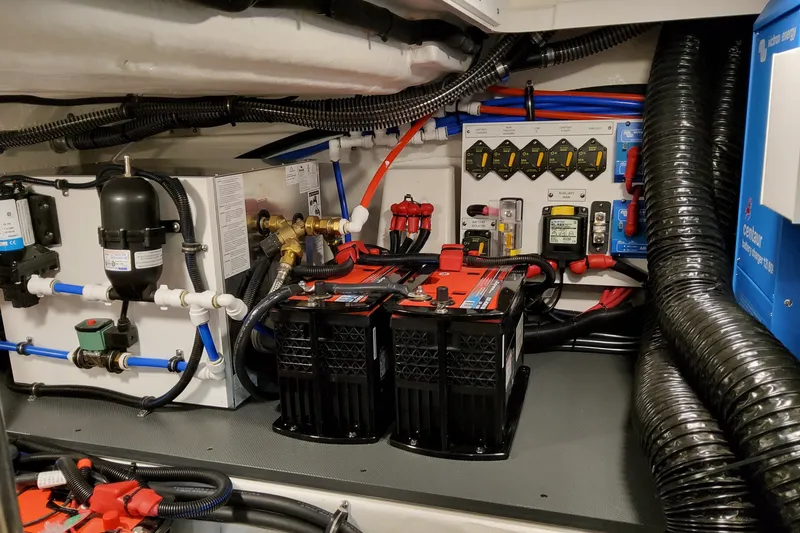 Slide: The Image of Engine room of 2027 Formula 400 Super Sport Crossover with batteries and wiring. - 53