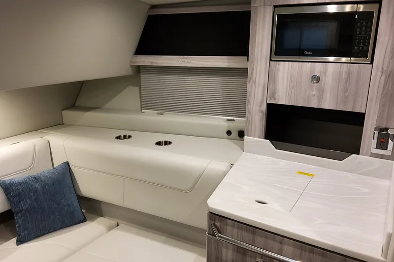 Slide: The Image of Interior of 2027 Formula 400 Super Sport Crossover with modern kitchen and seating area. - 25