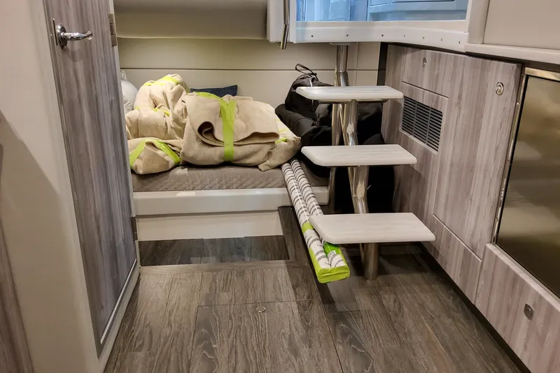 Slide: The Image of Interior of 2027 Formula 400 Super Sport Crossover with wooden flooring and compact stairs. - 60