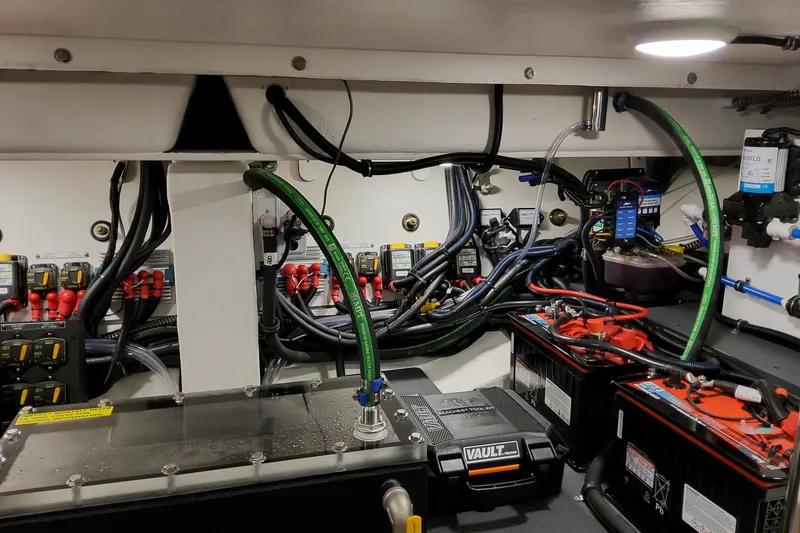 Slide: The Image of Engine room of 2027 Formula 400 Super Sport Crossover with batteries and wiring. - 54
