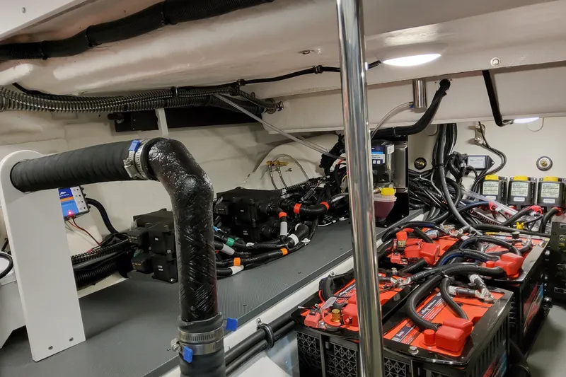 Slide: The Image of Engine room of 2027 Formula 400 Super Sport Crossover with batteries and wiring. - 55