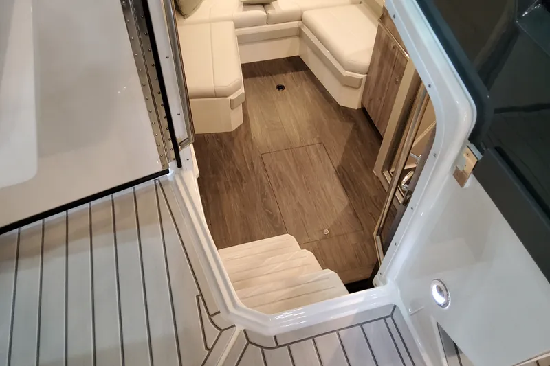Slide: The Image of Interior view of 2027 Formula 400 Super Sport Crossover, featuring sleek wood flooring and seating. - 24