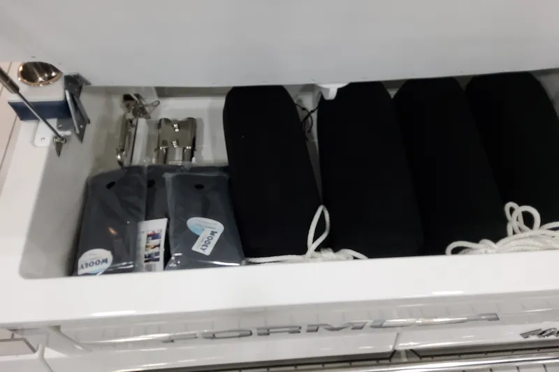 Slide: The Image of Storage compartment of 2027 Formula 400 Super Sport Crossover with boating accessories. - 49