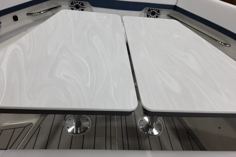 Slide: The Image of Interior view of 2027 Formula 400 Super Sport Crossover boat with sleek white tables. - 17