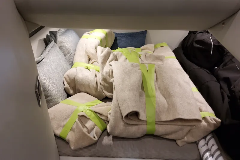 Slide: The Image of Cozy cabin interior of 2027 Formula 400 Super Sport Crossover with blankets and pillows. - 58