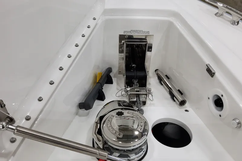 Slide: The Image of Anchor compartment of 2027 Formula 400 Super Sport Crossover boat, featuring stainless steel components. - 13
