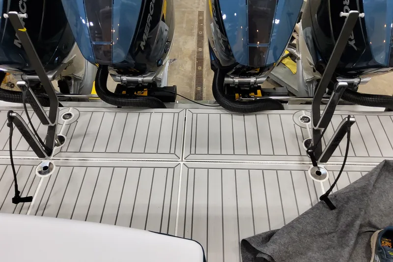 Slide: The Image of 2027 Formula 400 Super Sport Crossover boat with Mercury outboard engines on deck. - 48