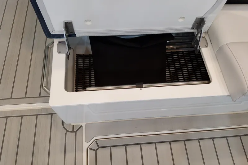 Slide: The Image of Open storage compartment on 2027 Formula 400 Super Sport Crossover boat deck. - 43