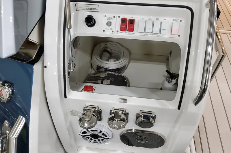 Slide: The Image of Control panel of 2027 Formula 400 Super Sport Crossover boat, featuring switches and storage. - 46