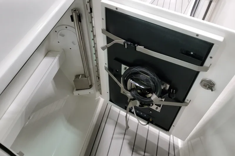 Slide: The Image of 2027 Formula 400 Super Sport Crossover storage compartment with secure equipment straps. - 20