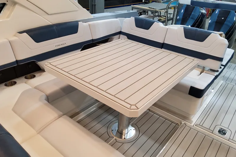 Slide: The Image of Luxury seating area on 2027 Formula 400 Super Sport Crossover yacht with sleek table design. - 42