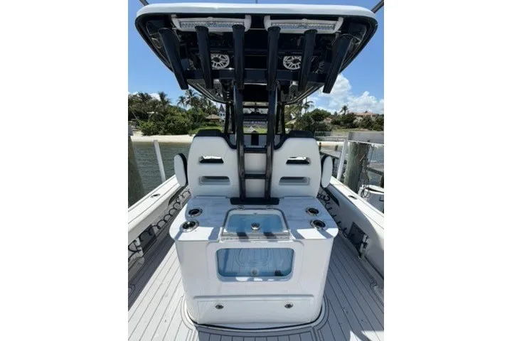 Slide: The Image of 2024 Tidewater 3100 Carolina Bay boat interior with seating and storage compartments. - 24