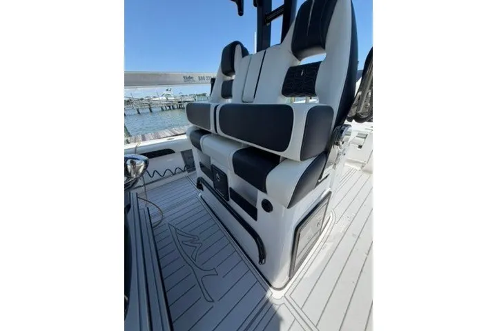 Slide: The Image of 2024 Tidewater 3100 Carolina Bay boat interior with sleek seating and modern design. - 22