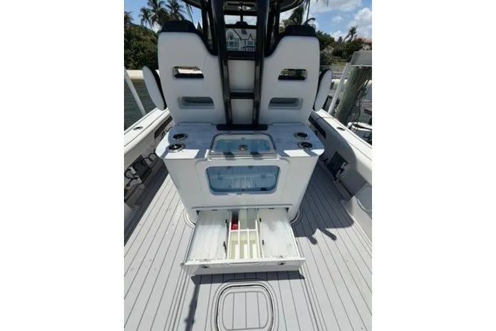 Slide: The Image of 2024 Tidewater 3100 Carolina Bay boat interior with seating and storage compartments. - 21