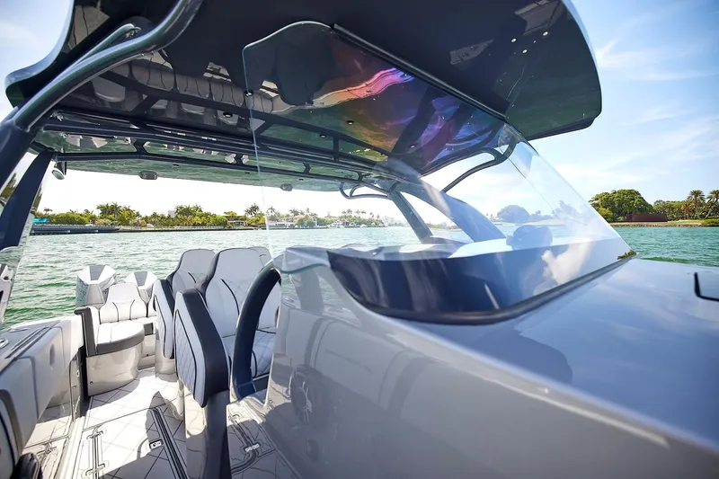 Slide: The Image of 2022 Midnight Express 43 Open boat interior with sleek design and waterfront view. - 27