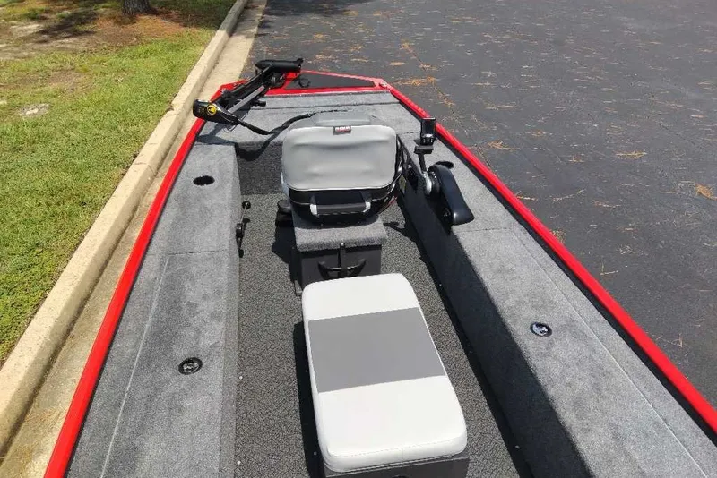 Slide: The Image of 2027 Tracker Panfish 17 boat interior with seating and fishing equipment. - 17