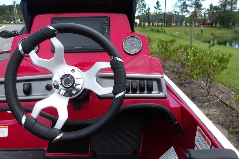 Slide: The Image of Steering wheel and dashboard of 2027 Nitro Z18 XL Pro boat, featuring modern controls. - 8