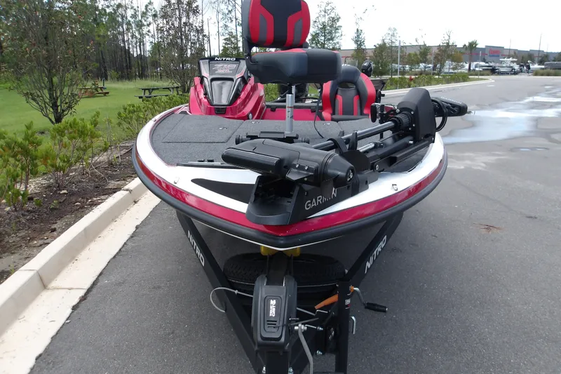 Slide: The Image of 2027 Nitro Z18 XL Pro boat with Garmin equipment, parked on a paved area. - 14