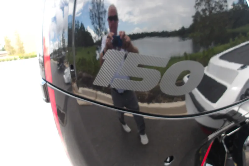 Slide: The Image of Reflection on Nitro Z18 XL Pro 2027 boat engine with "150" decal. - 6