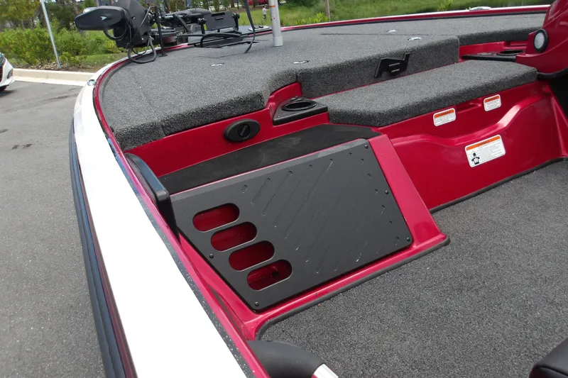 Slide: The Image of 2027 Nitro Z18 XL Pro boat deck with red and black accents, featuring storage compartments. - 17