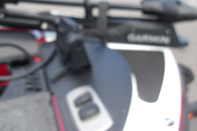 Slide: The Image of Blurred close-up of a 2027 Nitro Z18 XL Pro boat dashboard with Garmin equipment. - 13