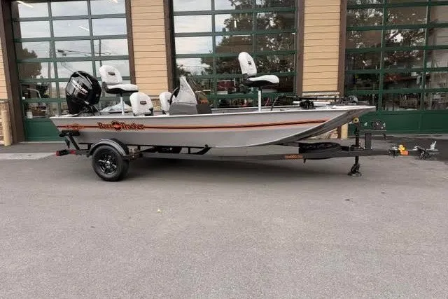 The Image of 2027 Tracker Bass Tracker Classic Limited boat on trailer, parked outdoors. - 0
