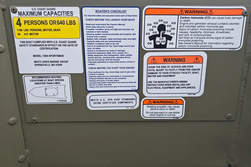 Slide: The Image of Boat safety and warning labels on a 2027 Tracker Grizzly 1654 T Sportsman. - 20
