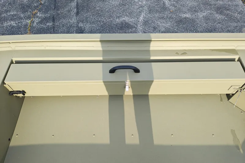Slide: The Image of 2027 Tracker Grizzly 1654 T Sportsman boat interior with storage compartment. - 14