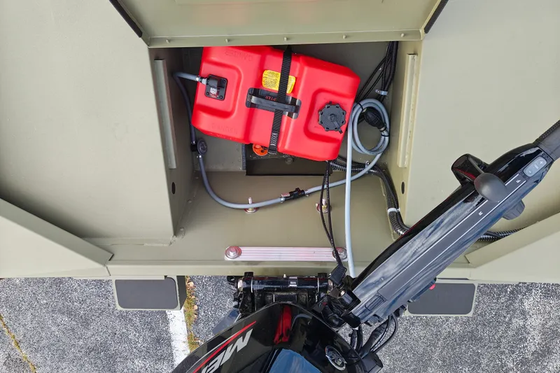 Slide: The Image of Tracker Grizzly 1654 T Sportsman 2027 boat interior with red fuel tank and wiring. - 25
