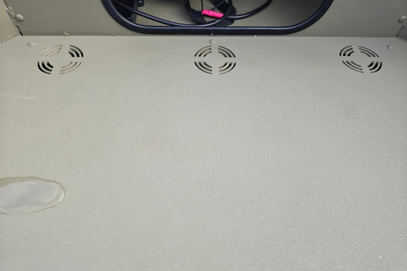 Slide: The Image of Interior view of 2027 Tracker Grizzly 1654 T Sportsman boat with vented flooring. - 23
