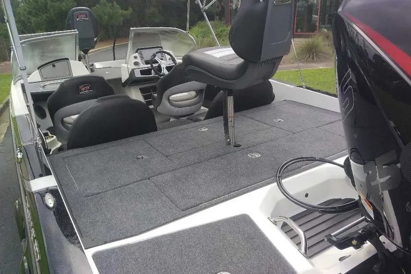 Slide: The Image of 2026 Ranger 212LS boat interior with seating and control panel. - 13