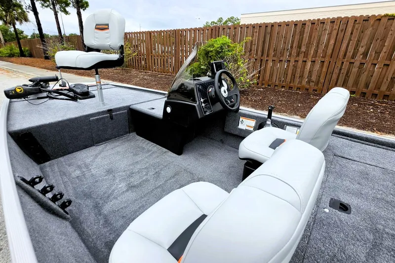 Slide: The Image of 2027 Tracker Bass Tracker Classic Limited boat interior with gray seating and steering console. - 15