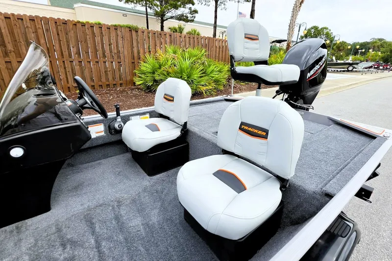 Slide: The Image of 2027 Tracker Bass Tracker Classic Limited boat interior with seating and steering wheel. - 16
