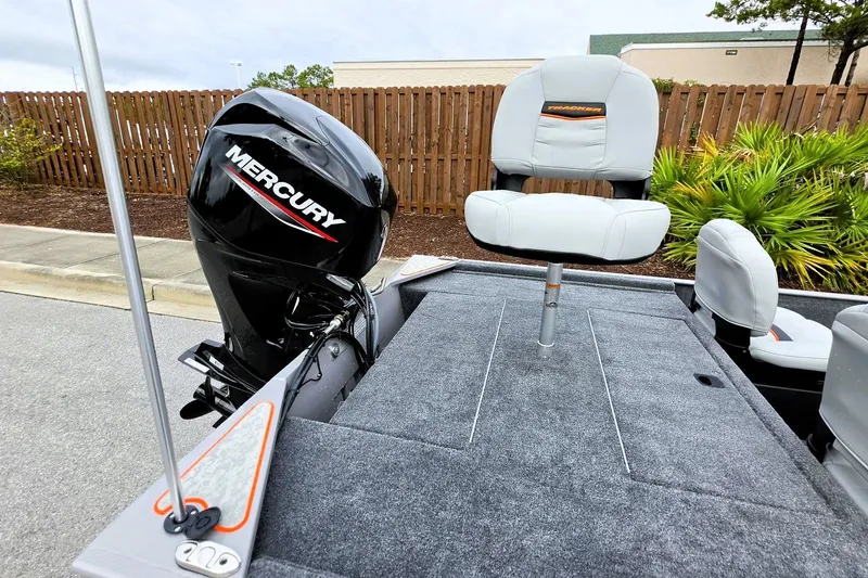Slide: The Image of 2027 Tracker Bass Tracker Classic Limited boat with Mercury engine and cushioned seating. - 19