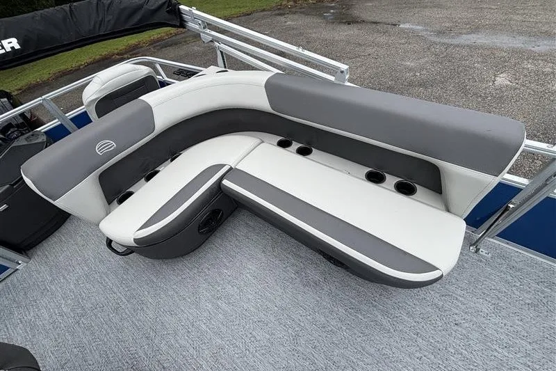 Slide: The Image of 2027 Sun Tracker Bass Buggy 18 DLX pontoon boat seating, featuring gray and white cushioned seats. - 14