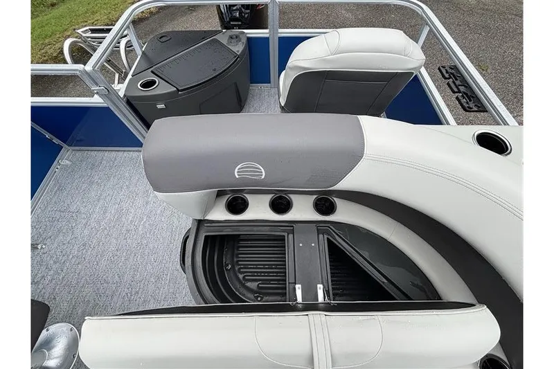 Slide: The Image of 2027 Sun Tracker Bass Buggy 18 DLX interior with seating and storage compartments. - 16