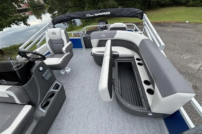 Slide: The Image of 2027 Sun Tracker Bass Buggy 18 DLX pontoon boat interior with seating and storage. - 15