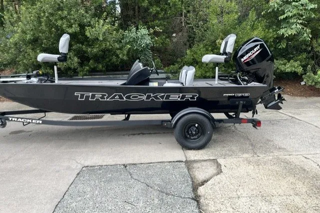 The Image of 2027 Tracker Pro 170 boat with Mercury engine on trailer, parked outdoors. - 0